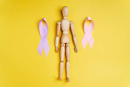 Healthcare and World cancer day concept on a yellow background. Top view. Copy spaceの写真素材