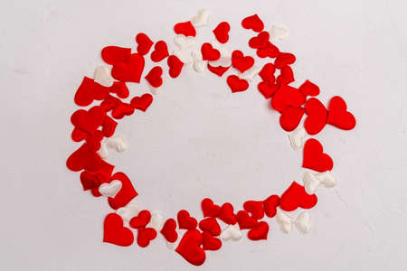Toy red hearts over white background. Valentines Day Symbols. Top view. Copy space