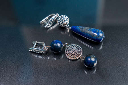 Blue natural lapis lazuli, earrings made of natural stones. Handmade jewelry bracelets.の写真素材