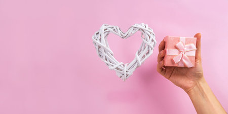 Gift box with white heart, concept of Valentines, anniversary, mothers day, copy spaceの写真素材