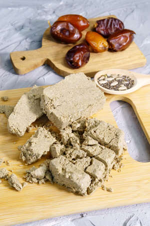 Sunflower halva. Halva pieces grey background. Top view. Vertical photo