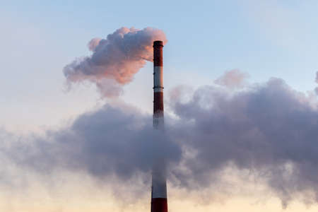 Smoke stack with smoke emission. Plant pipes pollute atmosphere. Industrial factory pollution. Space...