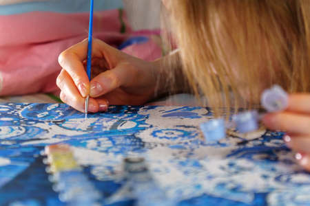 Close up painting by numbers. Creative hobby and leisure. Painting for beginners. Art idea.の写真素材