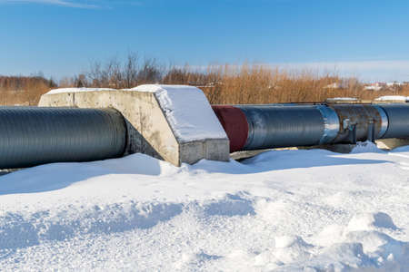 Industrial zone heating line, Steel pipelines and tanks, winter time, blue skyの写真素材