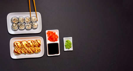 Sushi rolls on a black background copy space. Sushi roll menu. view from above. copy spaceの写真素材