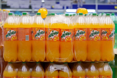 Tyumen, Russia-March 25, 2022: Orange flavored carbonated soft drinks from brands of Mirinda on the shelves of hypermarkets.のeditorial素材