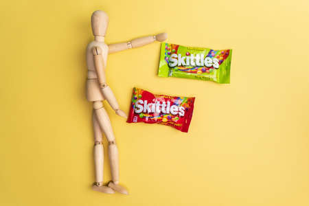 Tyumen, Russia-December 27, 2021: Original Skittles brand candies. multicolored background. delicious sweet skittlesのeditorial素材