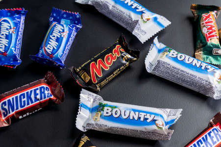 Tyumen, Russia-January 23, 2022: Snickers Mars Twix Bounty Milky Way chocolate bars. American...