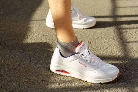 Tyumen, Russia-April 27, 2022: Skechers white sneakers logo trademark. Headquartered in Manhattan Beach, California, the brand was founded in 1992のeditorial素材