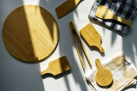 cutting board on a light concrete background. Cooking backdrop. Top view with space for your recipeの写真素材