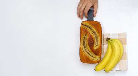 Baked banana bread. bakery, cafe, home chef, menu concepts. White background top view. copy spaceの写真素材