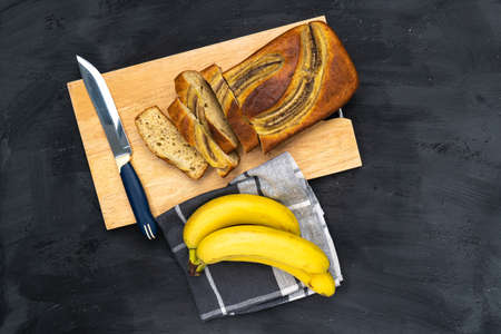 Roasted coffee beans pouring selective focus. Robusta variety inside the cloth bag.の写真素材