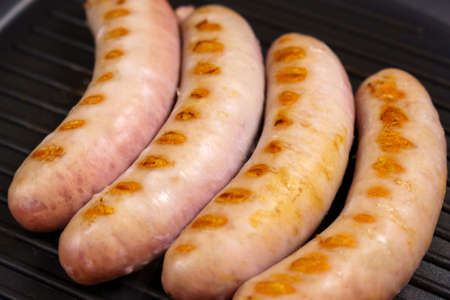 Homemade juicy grilled pork sausages with spices, close up. selective focusの写真素材