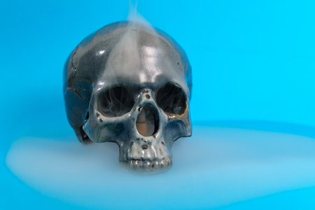 Halloween holiday concept. Scary skull on blue background. selective focusの写真素材