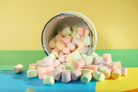 A lot of marshmallows close-up. Delicious dessert or addition to cocoa. color backgroundの写真素材
