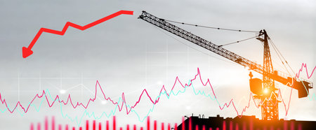 Crane and graph building. Investment in real estate business construction. Falling property prices