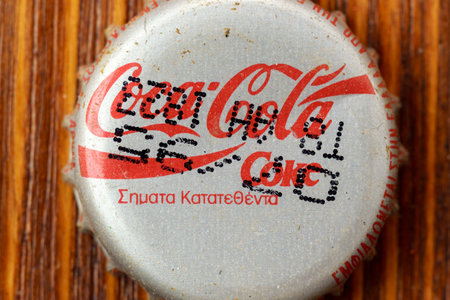 Tyumen, Russia-February 15, 2023: Vintage Coca Cola bottle cap. 1995 design, close-up selective...