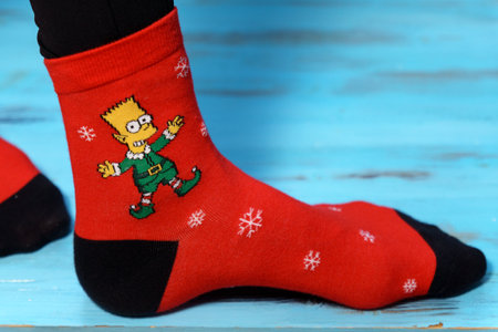 Tyumen, Russia-January 23, 2023: Bart Simpson from The Simpsons animated series logo on clothes, Christmas socksのeditorial素材