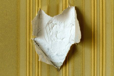 Patch in the plaster wall, Missing patch of paint in the middle. texture backgroundの写真素材