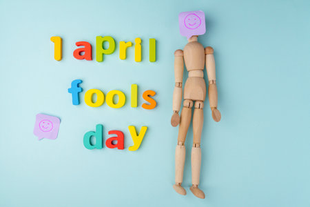 Surprise symbol blue background. April Fool. Joke with laughing faceの写真素材