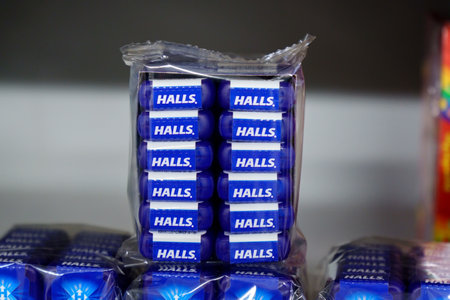 Tyumen, Russia-March 17, 2023: Halls mint candy displayed on shelves for sale at supermarket.