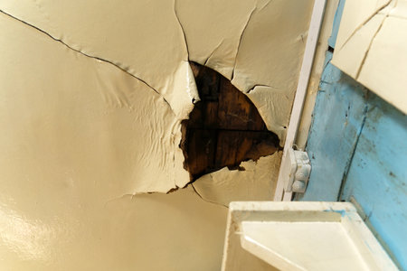Broken ceiling problem in house because rain water damage in raining season. selective focusの写真素材