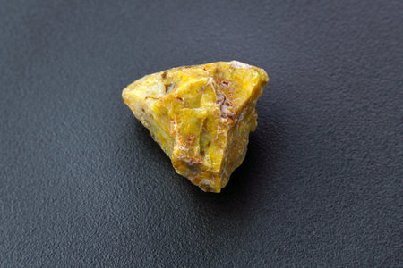 Rare boulder opal, mineral, black background. Opal is a hydrated amorphous form of silicaの写真素材