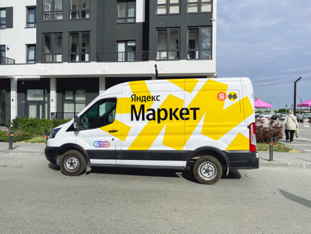 Tyumen, Russia-June 14, 2023: Branded cargo van of a large Russian marketplace Yandex Market. Text...
