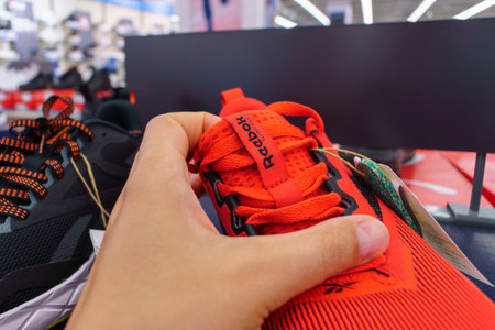 Tyumen, Russia-August 03, 2023: Modern red Reebok sneakers. Nanoflex TR V2.のeditorial素材