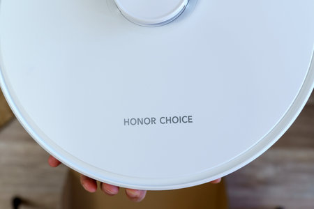 Tyumen, Russia-June 25, 2023: Smart Robot Vacuum CHOICE Honor Robot Cleaner R2. Selective focus