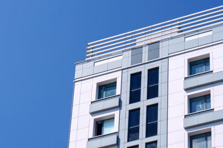 Part of modern business building against blue sky. Copy space