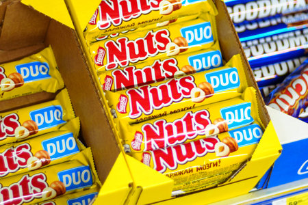 Tyumen, Russia-March 02, 2024: Nuts packets is neatly stacked on a shelf, each featuring for...