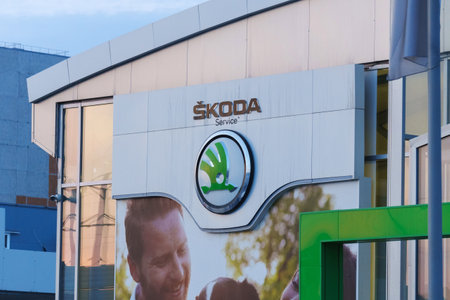 Tyumen, Russia-March 18, 2024: Skoda logo is displayed prominently in front of a commercial building, in Skoda vehicles.のeditorial素材