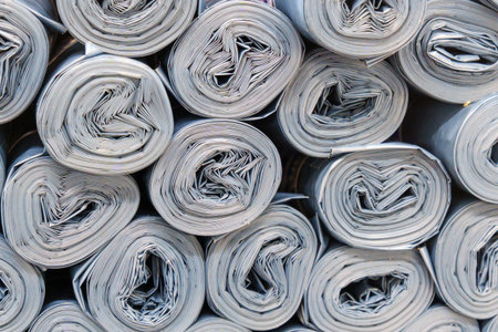 Gray Plastic rolls stacked in a disorderly manner, creating a sound of roller paper