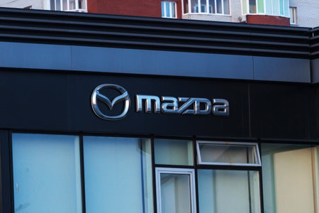 Tyumen, Russia-March 18, 2024: Mazda logo prominently. The logo is identifiable and adds to the buildings branding.のeditorial素材