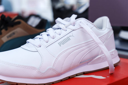 Tyumen, Russia-August 11, 2024: Trendy athletic shoe Puma is prominently showcased in a retail...