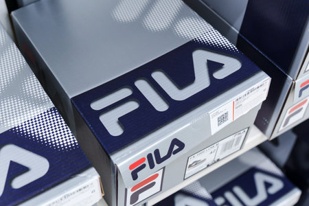 Tyumen, Russia-August 11, 2024: Close-up of a Fila sneaker showcasing the intricate lacing and...