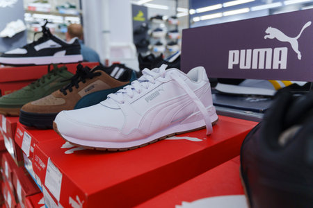 Tyumen, Russia-August 11, 2024: Stylish athletic shoe Puma displayed in a retail store with a modern design and vibrant colorsのeditorial素材