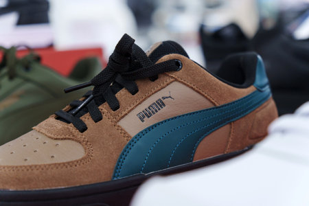 Tyumen, Russia-August 11, 2024: Trendy athletic shoe Puma is prominently showcased in a retail setting.のeditorial素材