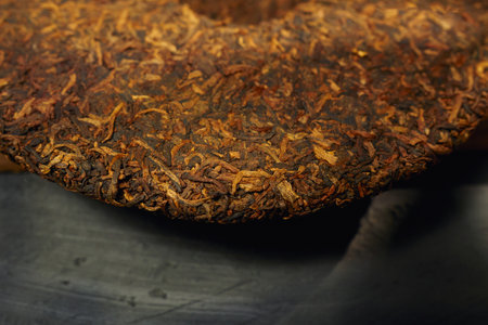 Puer tea displayed on a surface, showing its unique texture and colorの写真素材