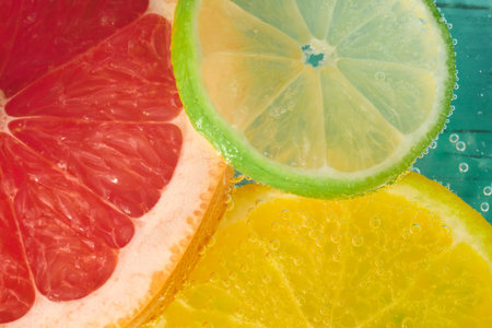 Colorful citrus slices float in sparkling water for a refreshing summer drink