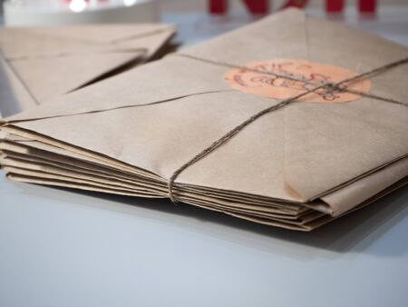 on the table are letters in Kraft envelopes tied with a rope. New year and Christmas decor conceptの写真素材