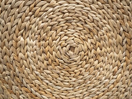 The woven texture of rattan in light brown color. Can be used as a background