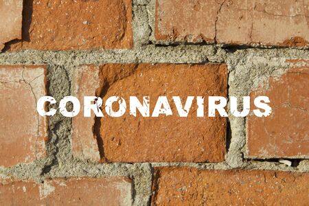 The inscription coronavirus on the brick wall. The concept of spreading the new virus 2019-ncov...