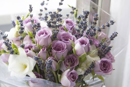 Composition of flowers delicate pink roses and white liliesの写真素材