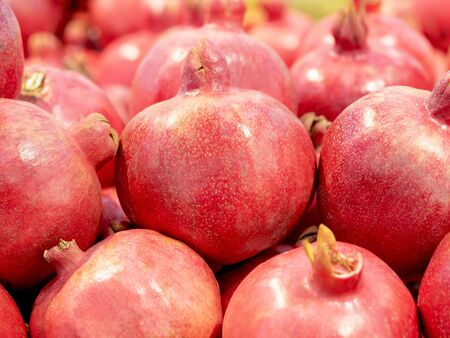 Fresh juicy pomegranate in the market. Superfood for a healthy diet full of beneficial elements and antioxidantの写真素材