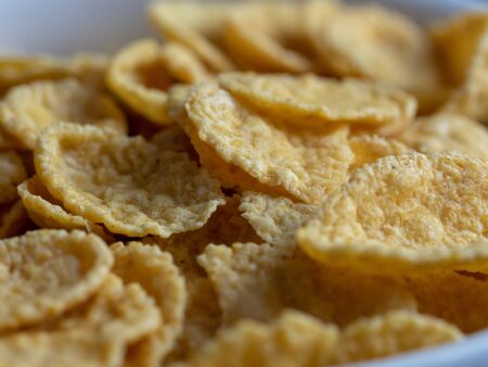 delicious crispy and healthy cornflakes closeup. The texture of the cereal. Perfect and healthy...