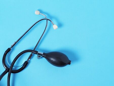 device for measuring blood pressure tonometer lying on a blue background. Concert of medicineの写真素材
