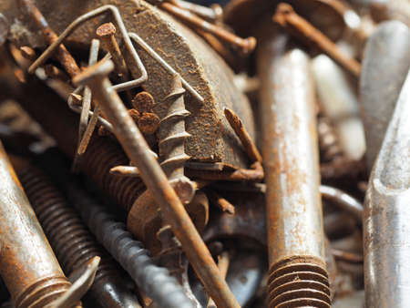 Dirty and rusty nuts and bolts close-up. Can be used as a backgroundの写真素材