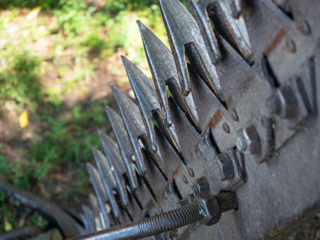 close-up of teeth on a tractor plow. Selective focus